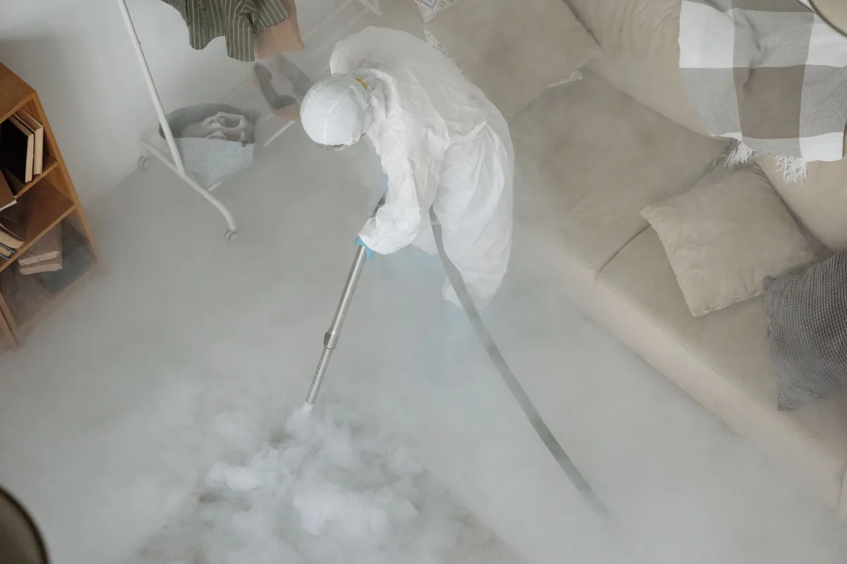 Biohazard cleanup technician in protective equipment, Old Seminole Heights, Tampa, FL